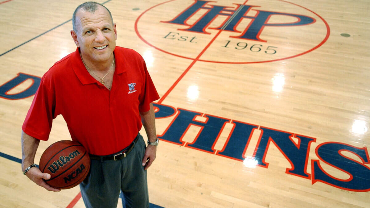 Hilton Head Preparatory School boys basketball coach Rich Basirico, photographed on the court that was named after him, has been named the all-area boys basketball coach of the year.