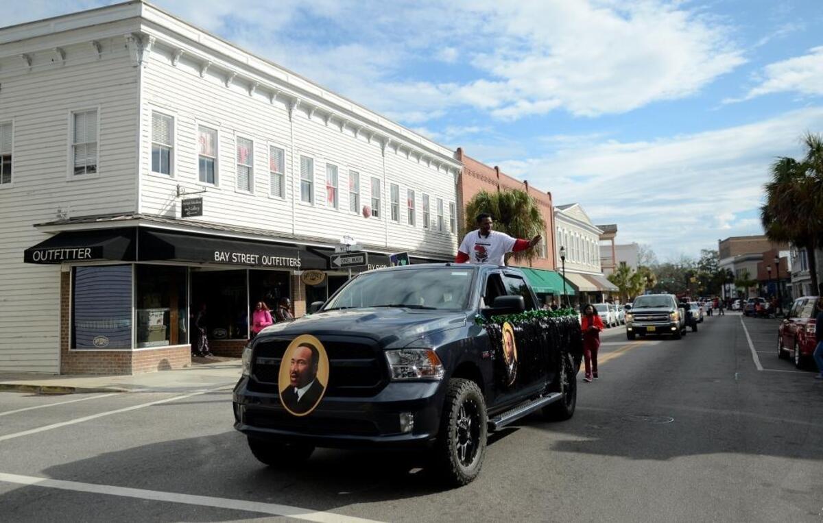 A vehicle sporting portraits of Martin Luther King Jr. drives down Beaufort’s Bay Street on Jan. 16, 2017, during the Martin Luther King Jr. Day Parade.