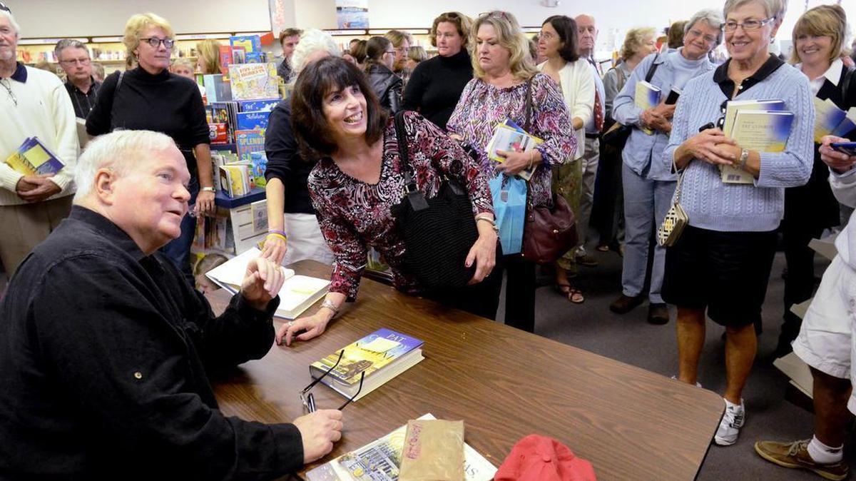 Author Pat Conroy poses for a picture with Helene Humber, of Sun City, at the Beaufort Bookstore in November 2013. Conroy was there to sign copies of latest book, "The Death of Santini: The Story of a Father and His Son."