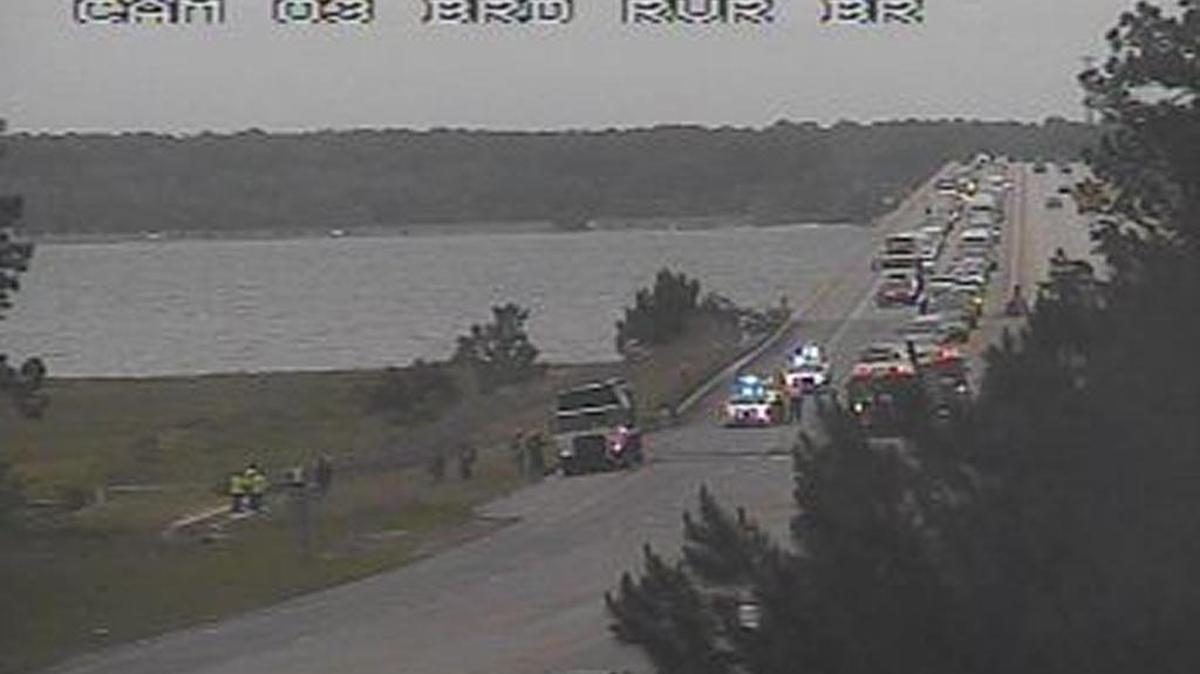 Firefighters douse flames on a vehicle around 4:30 p.m. Thursday in this image from a Beaufort County traffic camera near the Broad River Bridge on Okatie Highway.