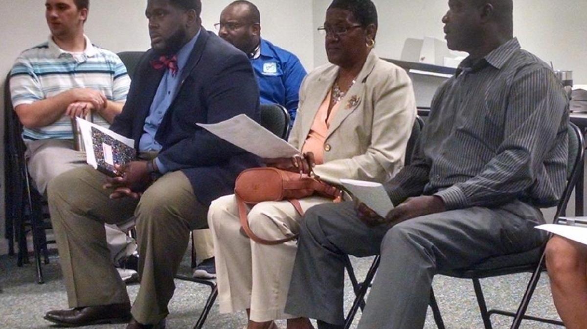 District 3 school board candidates William Smith (in bow tie) and Cynthia Gregory-Smalls, with her husband Mike, await the results of Thursday’s recount. Gregory-Smalls prevailed by three votes and will assume the seat vacated by Michael Rivers.