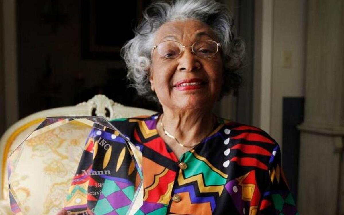 Etta Nickpeay Mann, a retired Beaufort educator, clutches her trophy while sitting for a portrait at her home on Lady’s island on April 28, 2015. Mann had just been inducted into the Penn 1862 Circle.