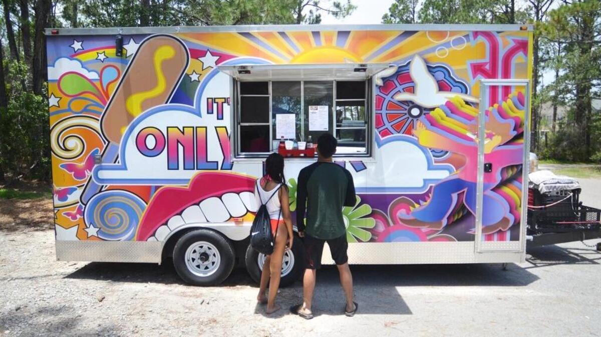 Beachgoers order food at the It’s Only Fair food truck over the summer. The truck will be at the Beaufort Food Truck Festival on Saturday.
