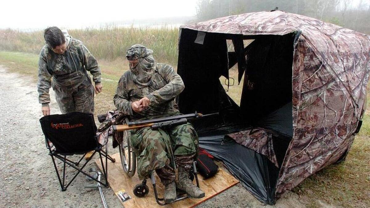 In 2011, Henry Black, right, and Katherine Moody prepare to take a break from hunting at the Savannah National Wildlife Refuge. The pair of hunters were taking part in the annual Mobility Impaired Hunt.