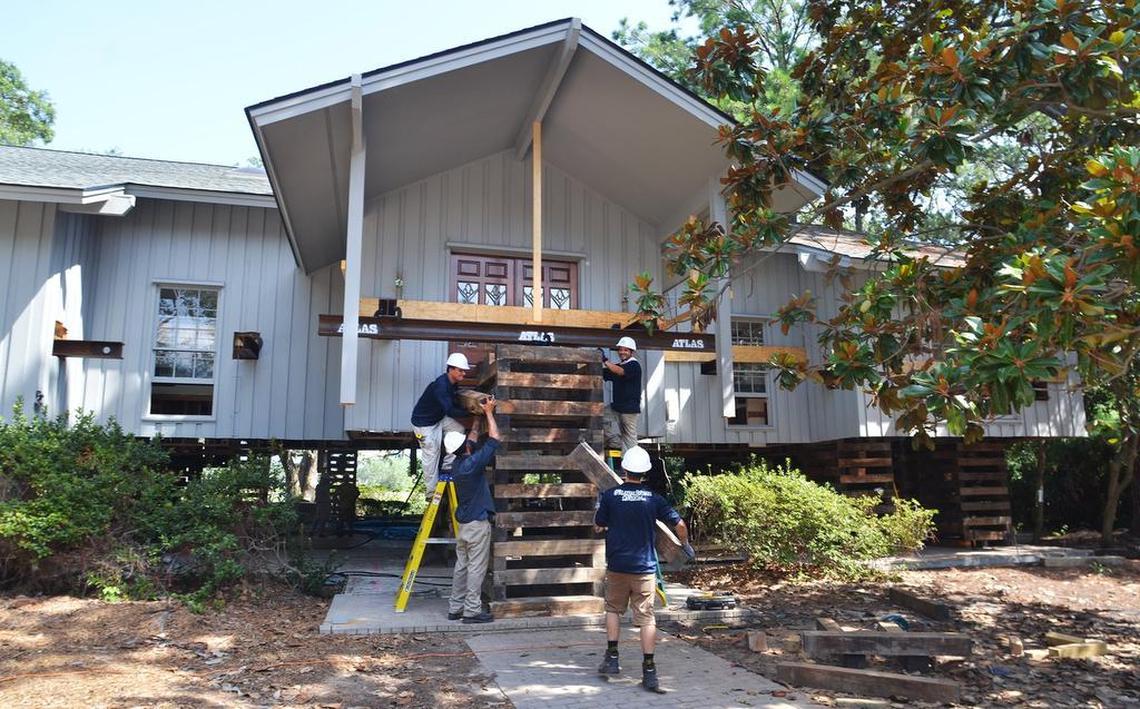 In this file photo, workers from Atlas Lifting and Demo shore up a crib under the front porch of a Hilton Head Island home as the lift nears eight feet. Home elevation is one of the mitigation techniques endorsed by state and national politicians as a long-term solution to the National Flood Insurance Program