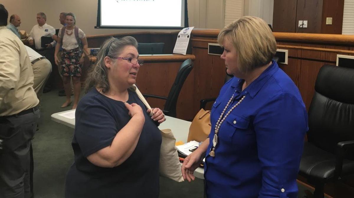 State Rep. Shannon Erickson, right, talks with a Beaufort resident after a meeting to address flooding concerns on Thursday, Sept. 28, 2017.