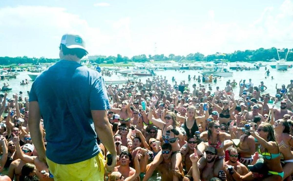 Musician Pat Cooper performs for a crowd during an inaugural Beaufort Water Festival concert at the Beaufort River sandbar last July. The concert is planned again for this year’s festival.