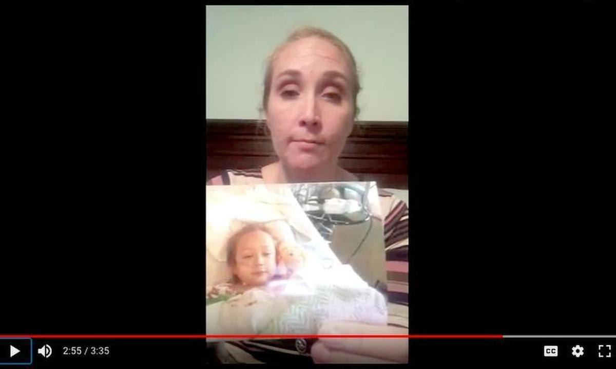 A screengrab of former Laurel Bay resident Amanda Whatley holding a photo of her daughter, stricken with leukemia, in a video she posted to YouTube in January. Whatley questions whether her daughter's disease was caused by contaminants at Laurel Bay, a military housing community in Beaufort.