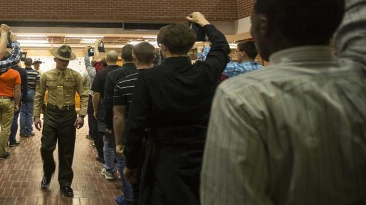 A drill instructor with Recruit Processing Company, Support Battalion, shouts commands to new recruits on Dec. 7, 2015, on Parris Island, S.C.