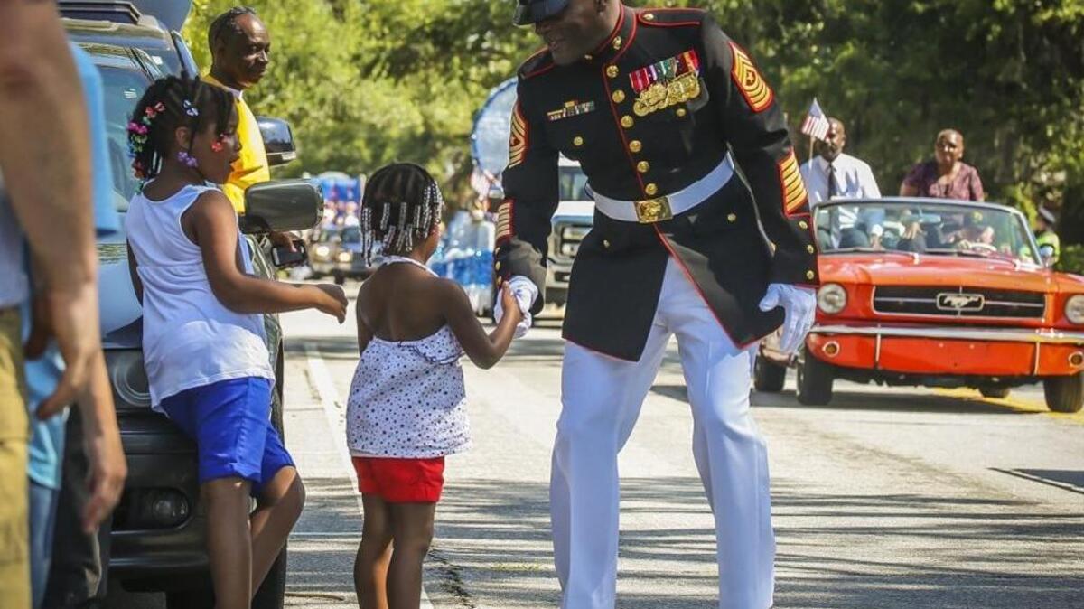 Sgt. Maj Derrick N. Mays greets Beaufort residents during a Memorial Day Parade on May 29, 2017, in downtown Beaufort, S.C.