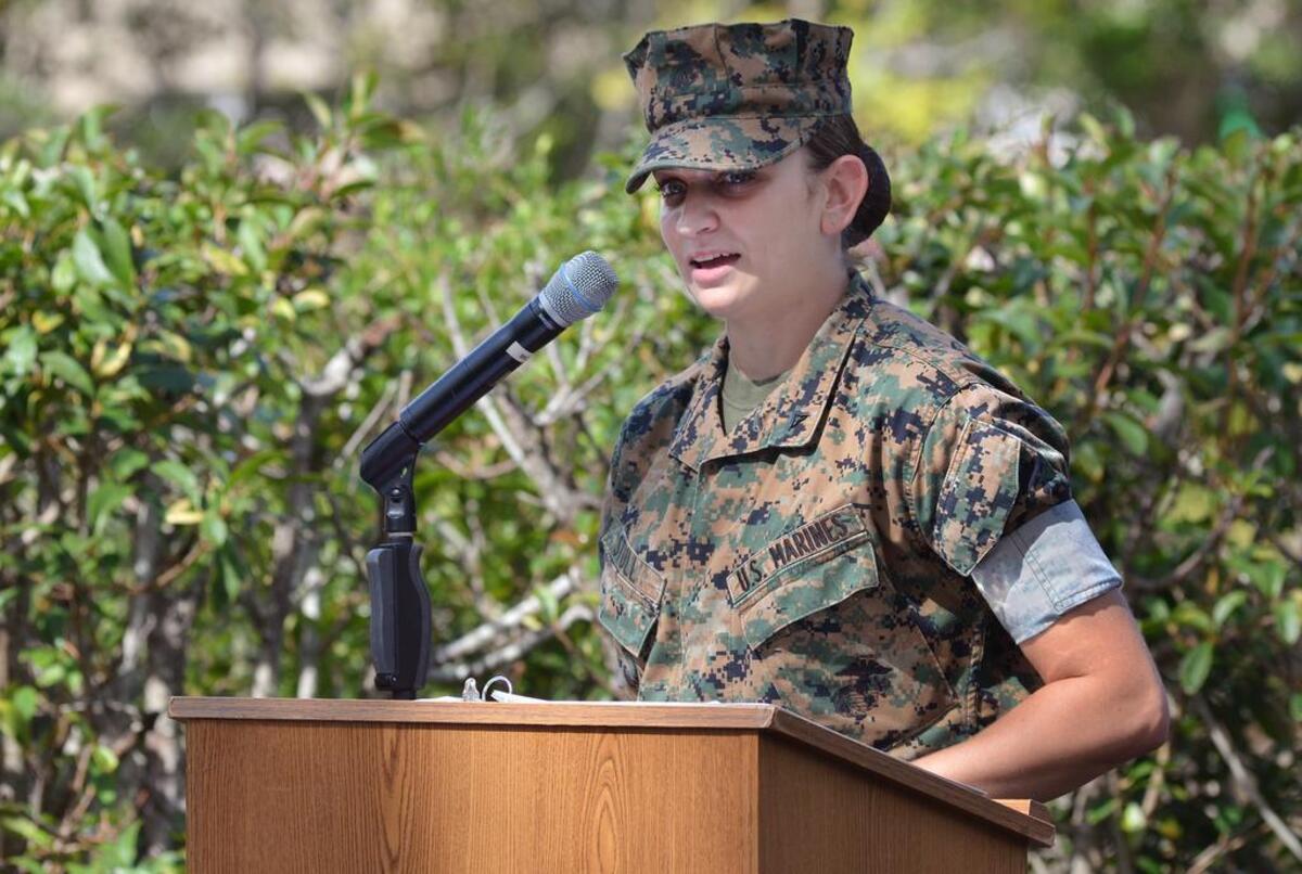 Lance Cpl. Alicia Stull speaks during the funeral for Corporal Sir William Legend III, the former bulldog mascot at Marine Corp Recruit Depot Parris Island that died on Sept. 17. Stull was Cpl. Legend's handler, and will be the handler for Legend’s replacement, Opha May.