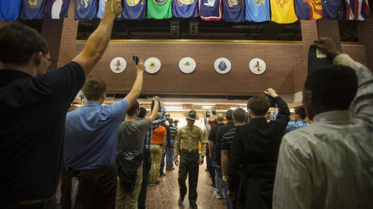 A drill instructor with Recruit Processing Company, Support Battalion, shouts commands to new recruits on Dec. 7, 2015, on Parris Island. Recruits learn from the moment they step on the yellow footprints they are expected to move with speed and intensity and to respond to all commands loudly and confidently.