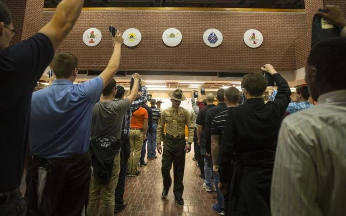 A drill instructor with Recruit Processing Company, Support Battalion, shouts commands to new recruits on Dec. 7, 2015, on Parris Island, S.C. Recruits learn from the moment they step on the yellow footprints they are expected to move with speed and intensity and to respond to all commands loudly and confidently.