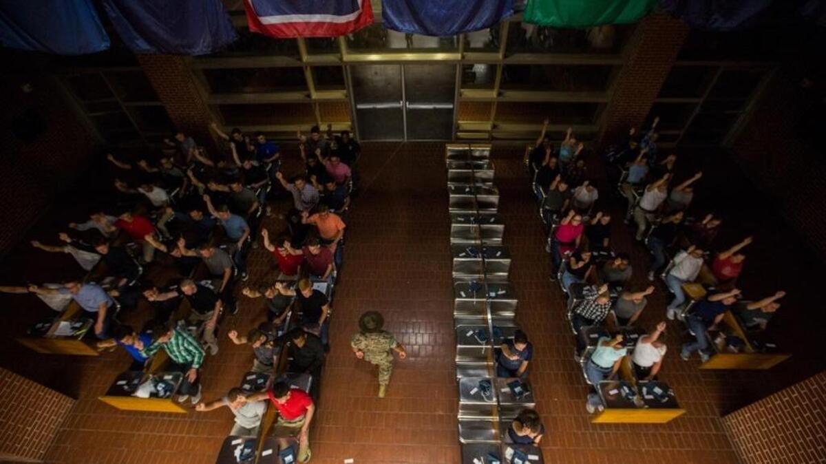 FILE: A U.S. Marine Corps drill instructor gives orders to new recruits June 5, 2017, on Parris Island, S.C.