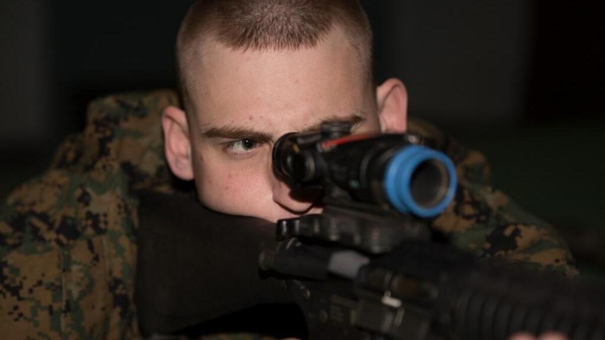 Timothy Rhodes uses a simulator to practice the fundamentals of marksmanship during his Make-A-Wish visit to Parris Island, S.C., Feb. 25, 2016. Parris Island, in conjunction with the Make-A-Wish Foundation, and Marine Corps Air Station Beaufort helped Rhodes fulfill his dream to experience some of what it takes to earn the title Marine during a two-day visit.