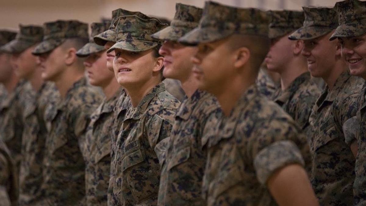 U.S. Marine Corps Pfc. Maria Daume, center, a mortarman assigned to Bravo Company, Infantry Training Battalion, School of Infantry-East, graduates from the Basic Mortarman course on March 23, 2017, at Camp Geiger, N.C.