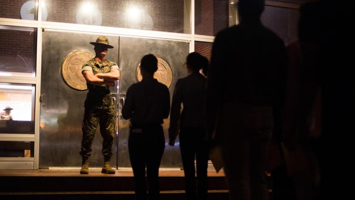 In June a U.S. Marine Corps senior drill instructor with Recruit Processing Company, Support Battalion, orders recruits to walk through the iconic silver doors at Marine Corps Recruit Depot Parris Island.