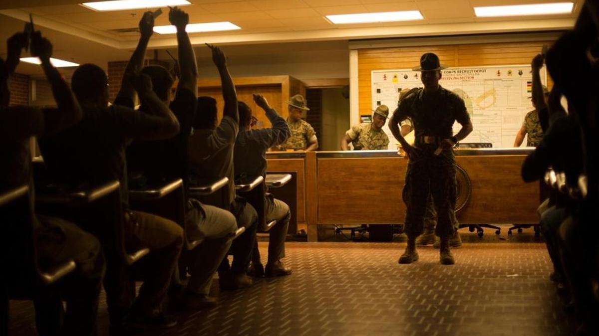 A Marine Corps Recruit Depot Parris Island drill instructor gives commands to new trainees recently arrived at the depot on Parris Island, S.C.