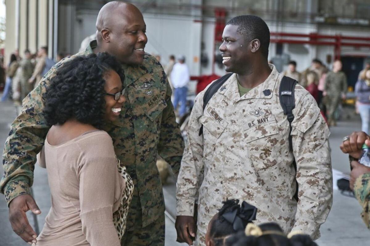 A Sailor is greeted by friends and family after his return a seven month deployment, Nov. 21, aboard Marine Corps Air Station Beaufort. Marine All-Weather Fighter Attack Squadron 224 left for the deployment to support combat operations in the Central Command area of operations, May 8. The Sailor is with VMFA(AW)-224.