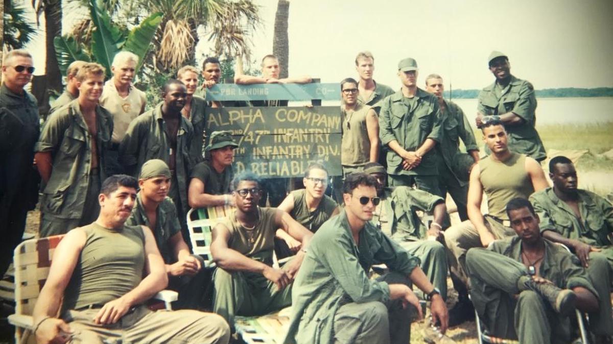The “Forrest Gump” cast and crew shoots on location near Beaufort. Dale Dye, military adviser to the blockbuster film, standing fourth from left, suggested Hunting Island as a good place to film Vietnam scenes.