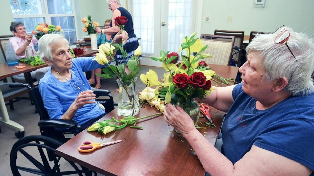 Rita Wegmann, left, and Diana Brown, residents at Bloom at Bluffton retirement home, participate in a flower arranging class on Friday. In the next two years, Beaufort County can expect a 33 percent increase in its capacity for senior housing.