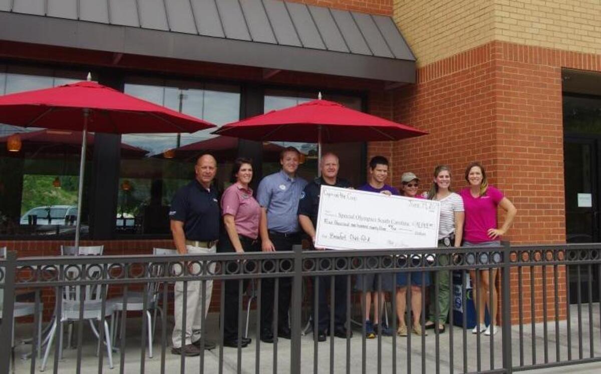 Beaufort Police Department and Chick-fil-A raised nearly $4,200 for Special Olympics South Carolina during the Cops on the Coop fundraiser on Friday. They handed over the giant check Wednesday morning at the Boundary Street restaurant. Left to right: Douglas Kahn, a coordinator of the event; Darla Ballard, Chick-fil-A manager; Garrett Morgan, Chick-fil-A manager; Police Chief Matt Clancy; Special Olympics bowling and track athlete AJ Lehe; JT Del Valle, Special Olympics coach and mother to an athlete; Beaufort Police Inv. Stephanie Karafa; Amy Gege, marketing and development for Special Olympics South Carolina.
