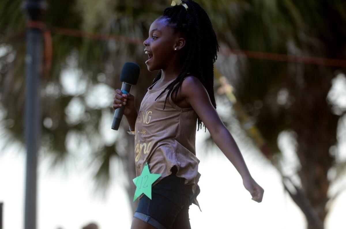 Damayla Smith sings during the Talent Show on Wednesday, July 20, 2016, during the 61st annual Beaufort Water Festival at Henry C. Chambers Waterfront Park. Smith place first in the 6 to 9-year-old individual performance category in the show. This year’s show is at 7 p.m. Wednesday.