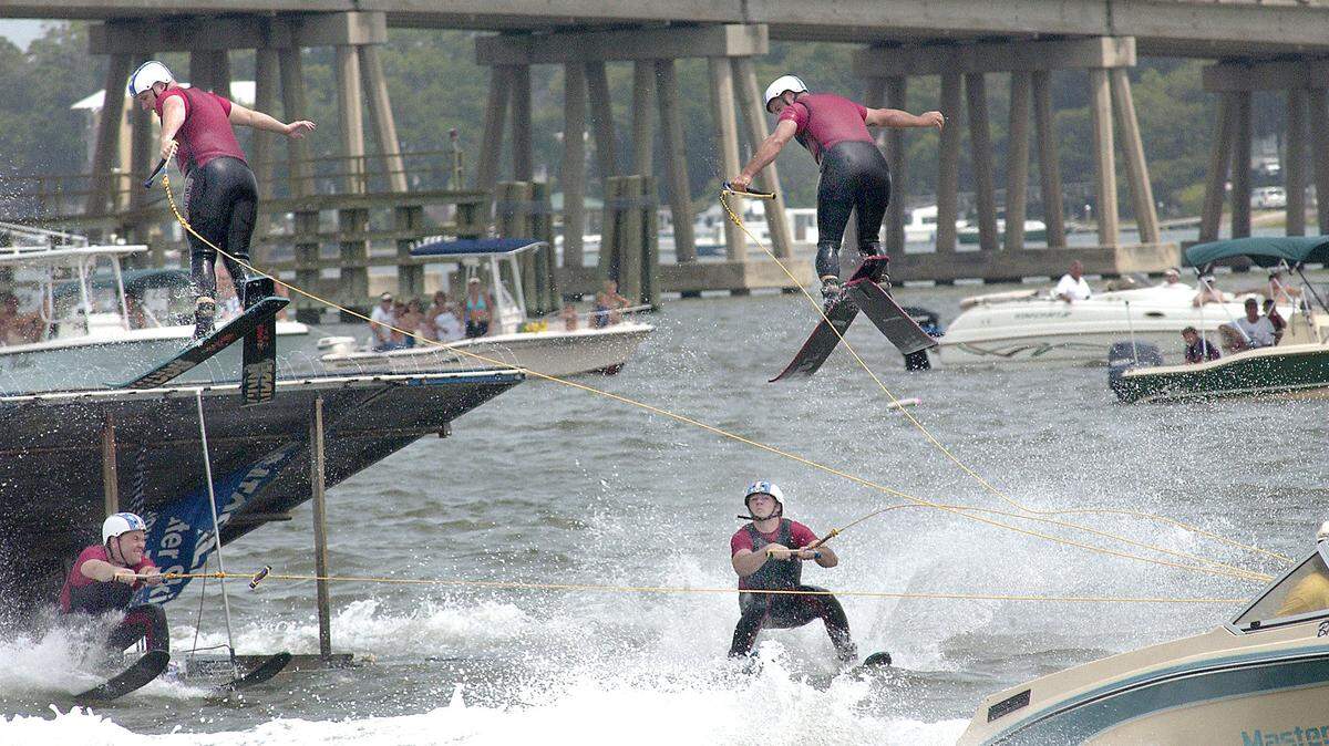 Skiers with the Gatorland Ski Show keep an eye on each other as they perform in the Beaufort River on Saturday during the Beaufort Water Festival.