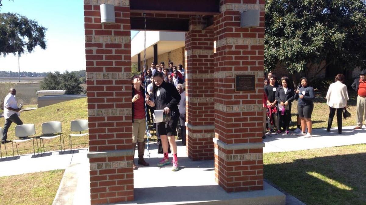 Beaufort Middle School students react to the sound of the historic bell on the campus of Technical College of the Lowcountry. The bell, originally made in the early 1900s for the Mather School, is rung each February on Mather Day by the school’s alumni.