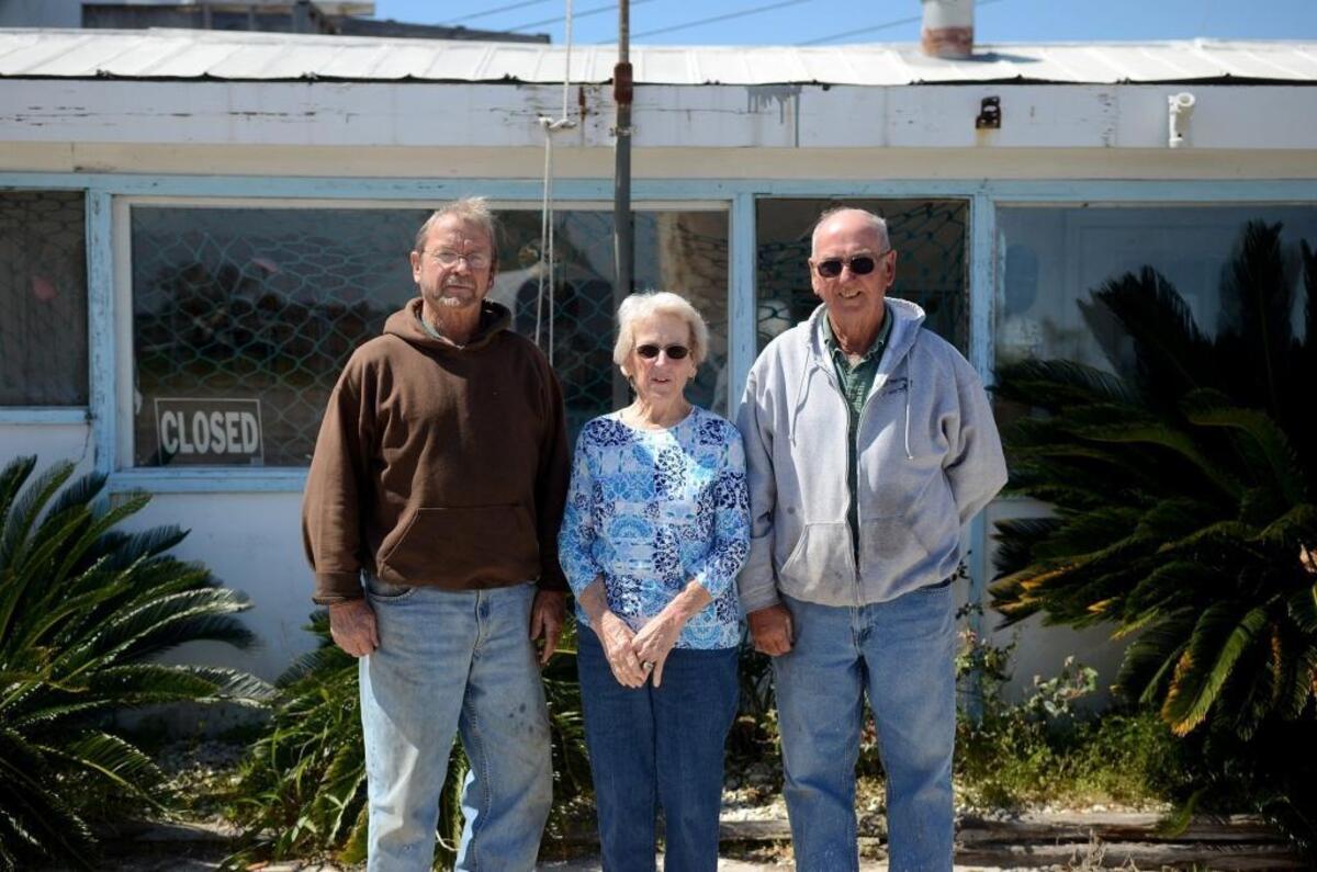 From left, Robert Gay, Hilda Upton and Charles Gay stand for a portrait in front of the original portion of the Gay Fish Company on Friday, March 17, 2017, on St. Helena Island. That part of the building was built by their father in the 1940s. 