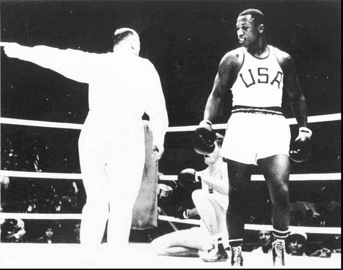 This file photo shows Beaufort-born Joe Frazier during a match at the 1964 Olympic Summer Games held in Tokyo. Frazier won gold in the Heavyweight Division at the games.