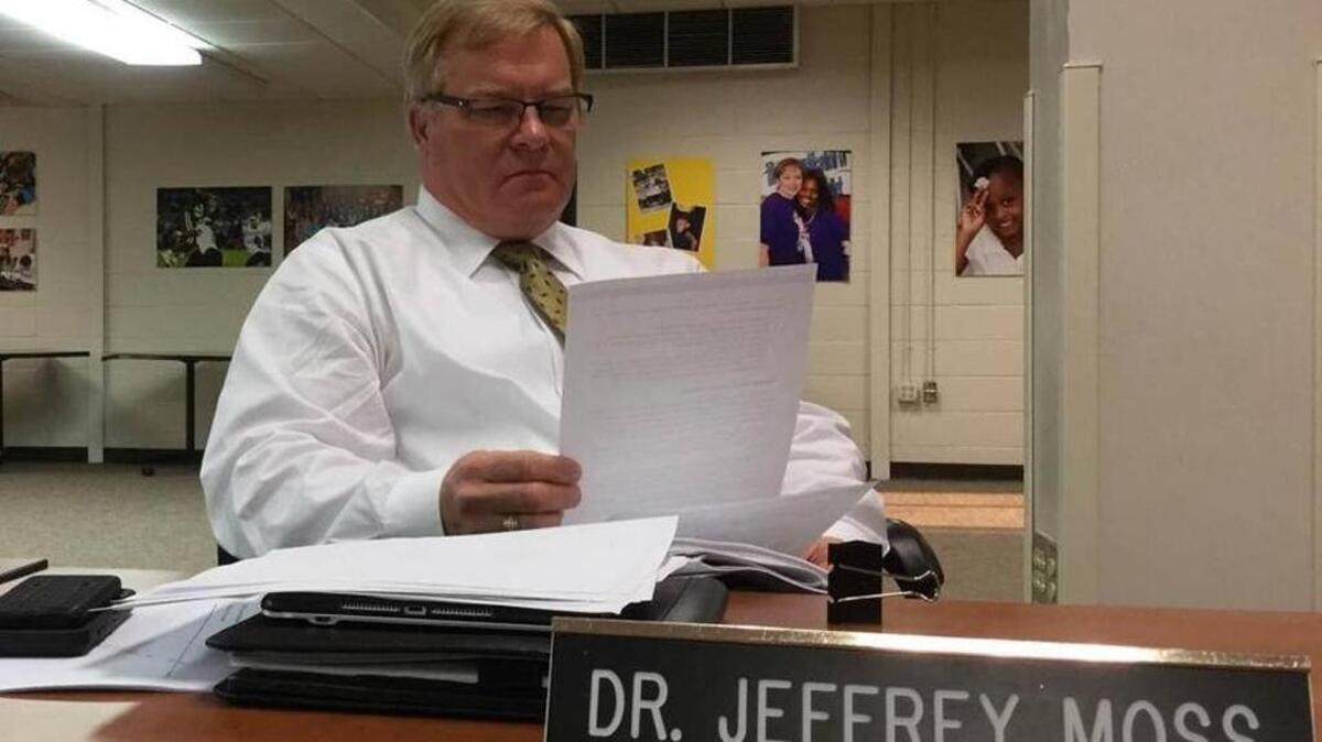 Beaufort County School District Superintendent Jeff Moss reviews paperwork while members of the county board of education discuss his annual performance review in a closed executive session in November 2016.