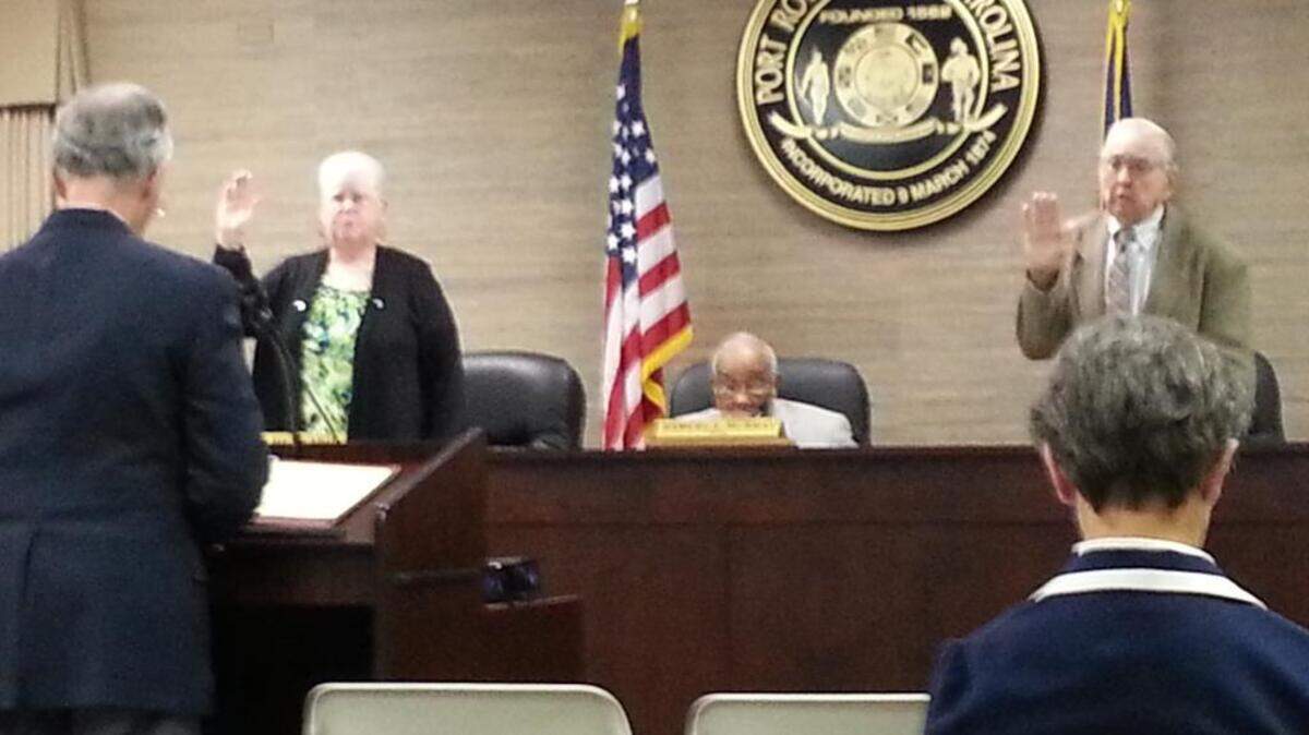 Mary Beth Gray-Heyward and Vernon DeLoach are sworn to four-year terms during the Port Royal Town Council meeting Dec. 11, 2013.