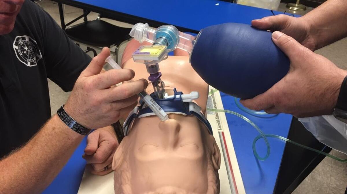 Burton Fire District firefighters demonstrate the administration of Narcan, which counteracts an opiod overdose. The drug was previously available to paramedics but only recently was allowed for law enforcement and firefighters’ use.