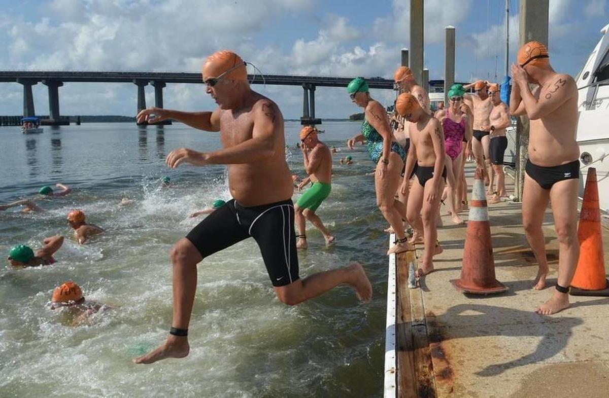 Swimmers jump in the water at Port Royal Landing Marina to start the 2016 Beaufort River Swim. The open-water event is a fundraiser for the YMCA’s swim lesson programs.