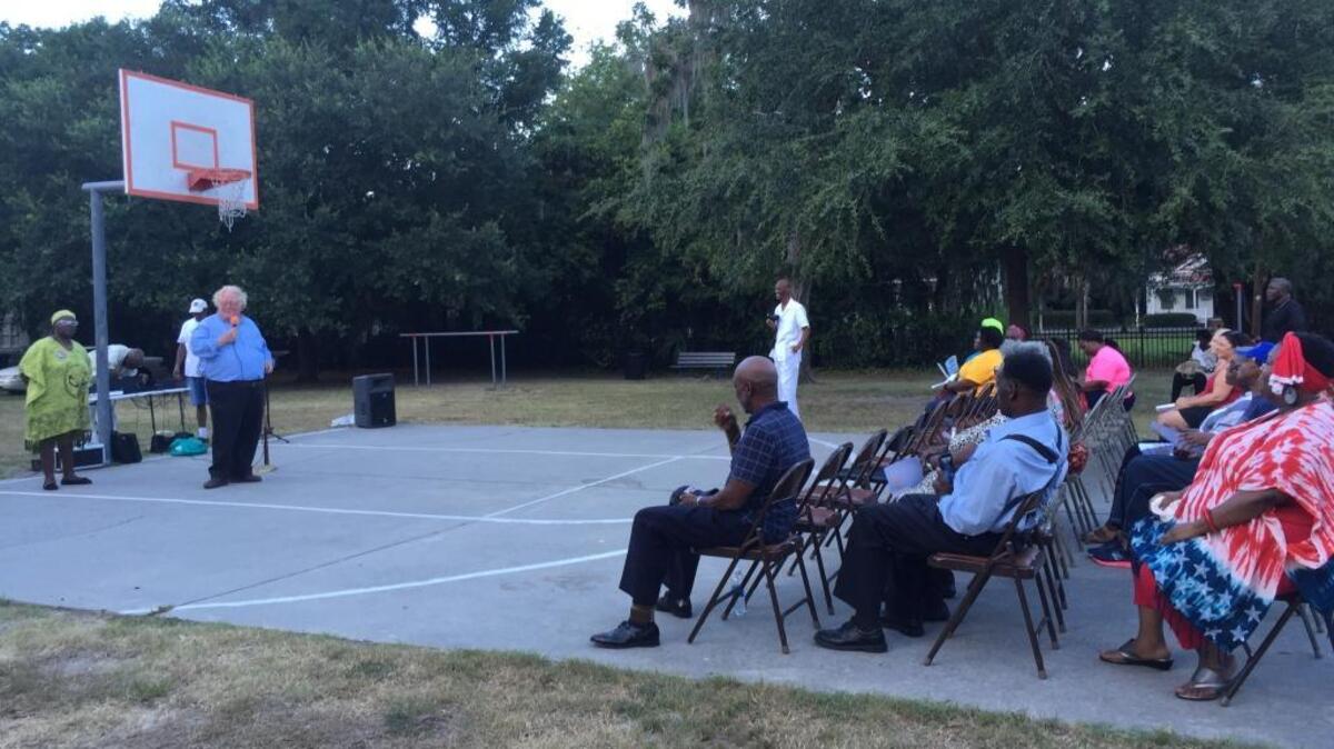 Beaufort Mayor Billy Keyserling addresses a crowd gathered at a prayer rally Saturday night at Washington Street Park. He joined the crowd in uniting against recent acts of violence, including shootings by police officers and those targeting police officers.