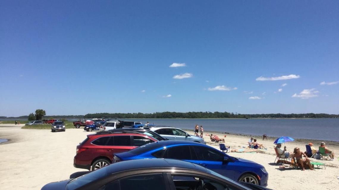 The Sands beach in Port Royal is packed on a recent Sunday afternoon. The public beach is unique in that cars — for now — can drive right up to the water.