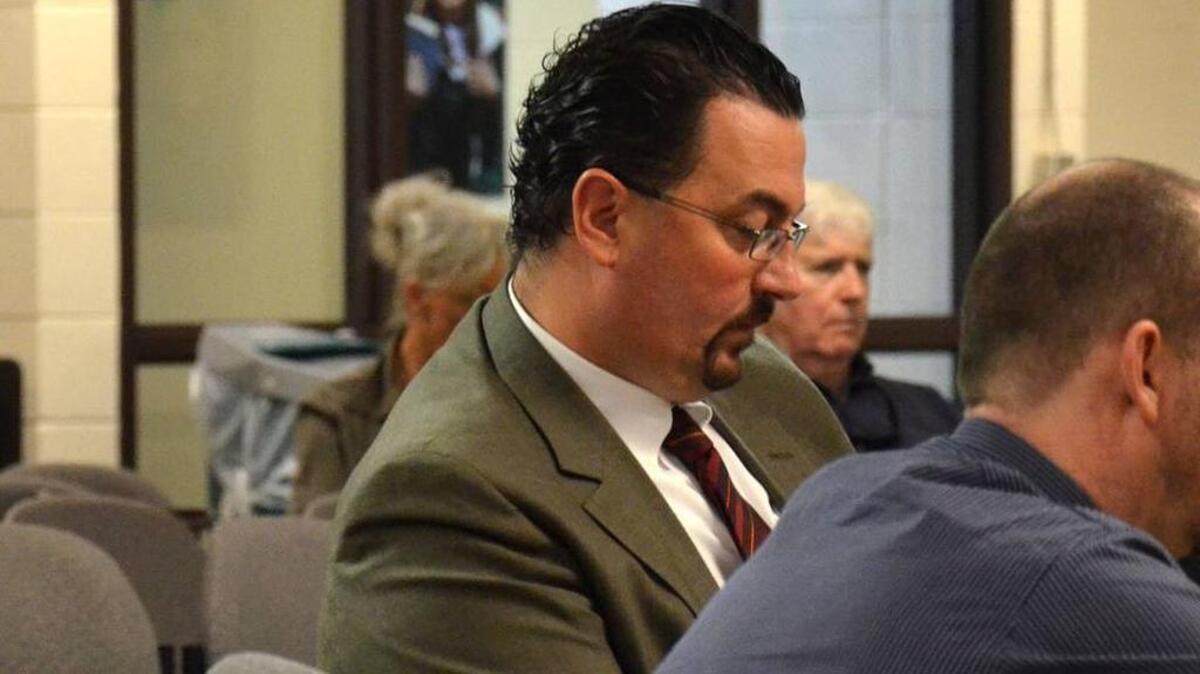 Former H.E. McCracken Middle School principal Phillip Shaw listens Nov. 2, 2013, to opening arguments during his hearing to appeal his firing by the Beaufort County School District.