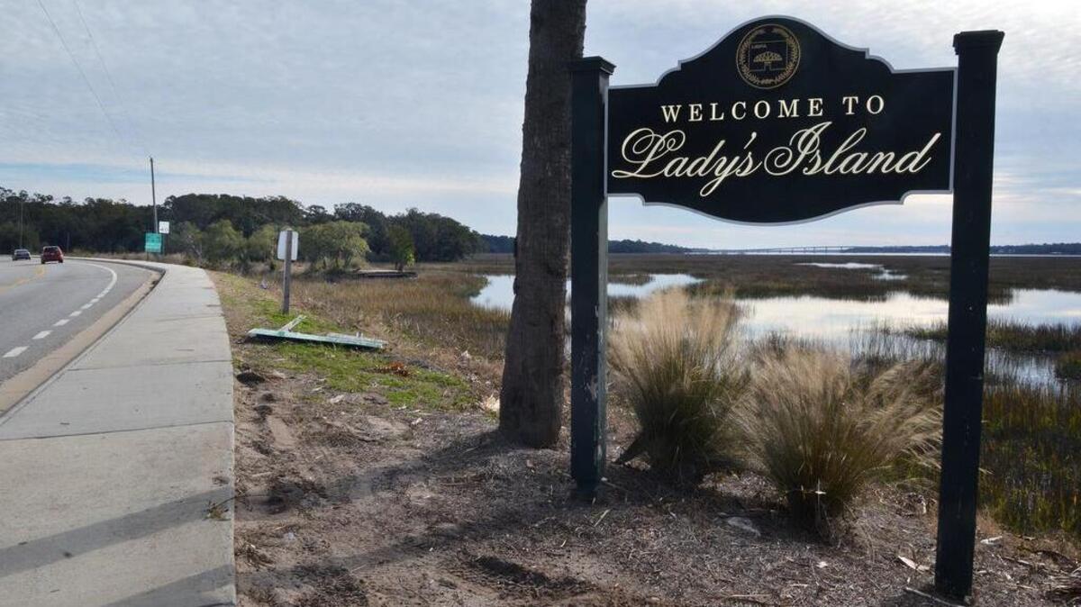 A sign along Sea Island Parkway just south of the Woods Memorial Bridge to downtown Beaufort welcomes motorists to Lady's Island on Wednesday. In the background at left is the 19-acre Whitehall property, which is being eyed by developers for possible residential and commercial development.