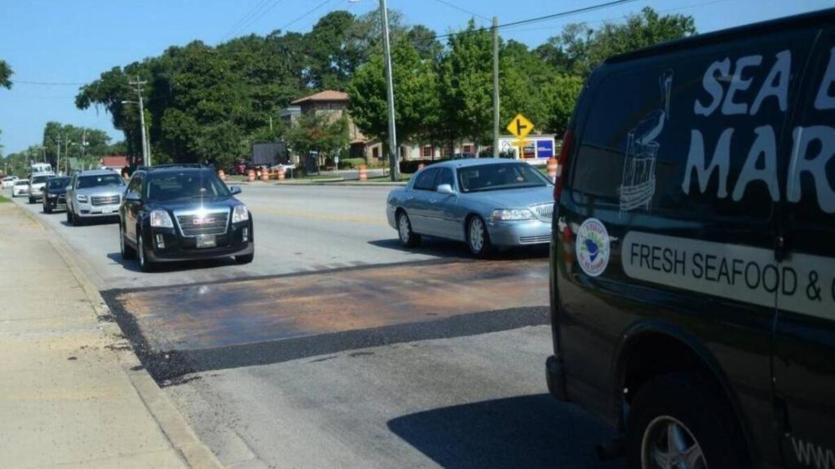 A steel plate covers a sinkhole on Boundary Street in July 2016. The road is expected to be repaired this weekend, June 17 and 18, 2017.