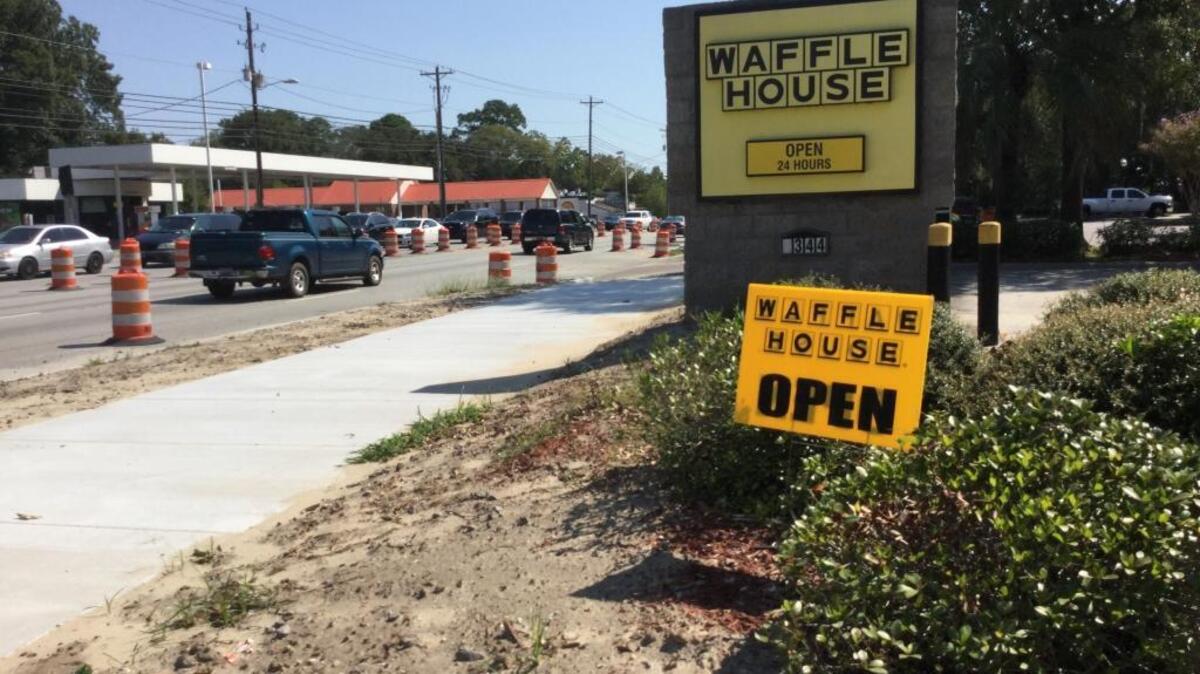 A sign outside Waffle House on Boundary Street lets drivers know the restaurant is open during road construction. Traffic will shift to the south side of Boundary Street starting Oct. 3.