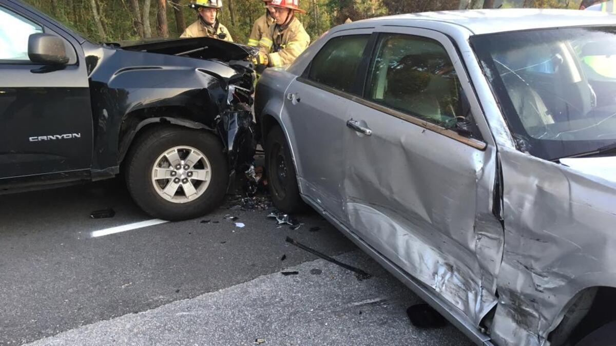 Firefighters work the scene of an early morning crash Tuesday, Sept. 19, 2017, at Broad River Boulevard near Riley Road.