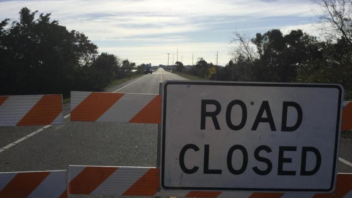 A barrier on Sea Island Parkway, near the Harbor River bridge, keeps motorists from Harbor, Hunting and Fripp islands in northern Beaufort County in the aftermath of Hurricane Matthew.