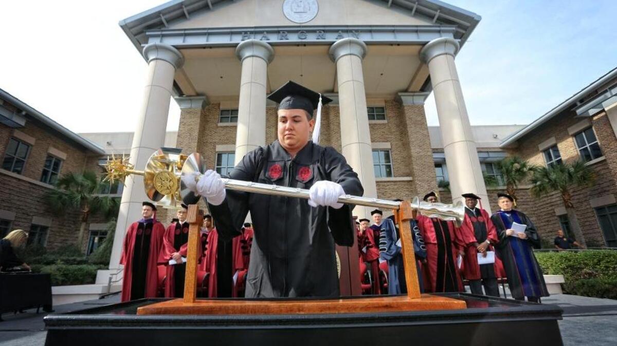 Pascale Rocca places the university mace at a ceremony at USCB. Rocca, originally from Canada, graduated from USCB on April 29, 2016. She played soccer for the Sand Sharks and was student body president her senior year. She’ll stay in the area after graduation and work for the USCB admissions office before becoming the university’s AmeriCorps VISTA staffer in July.