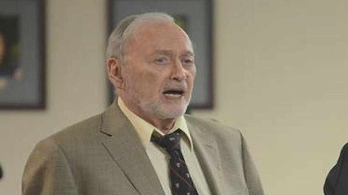 Board member Paul Roth (left) speaks with superintendent Jeff Moss before a special meeting Sept. 21, 2015, to discuss issues surrounding the hiring of Moss' wife to an administrative position with the district.