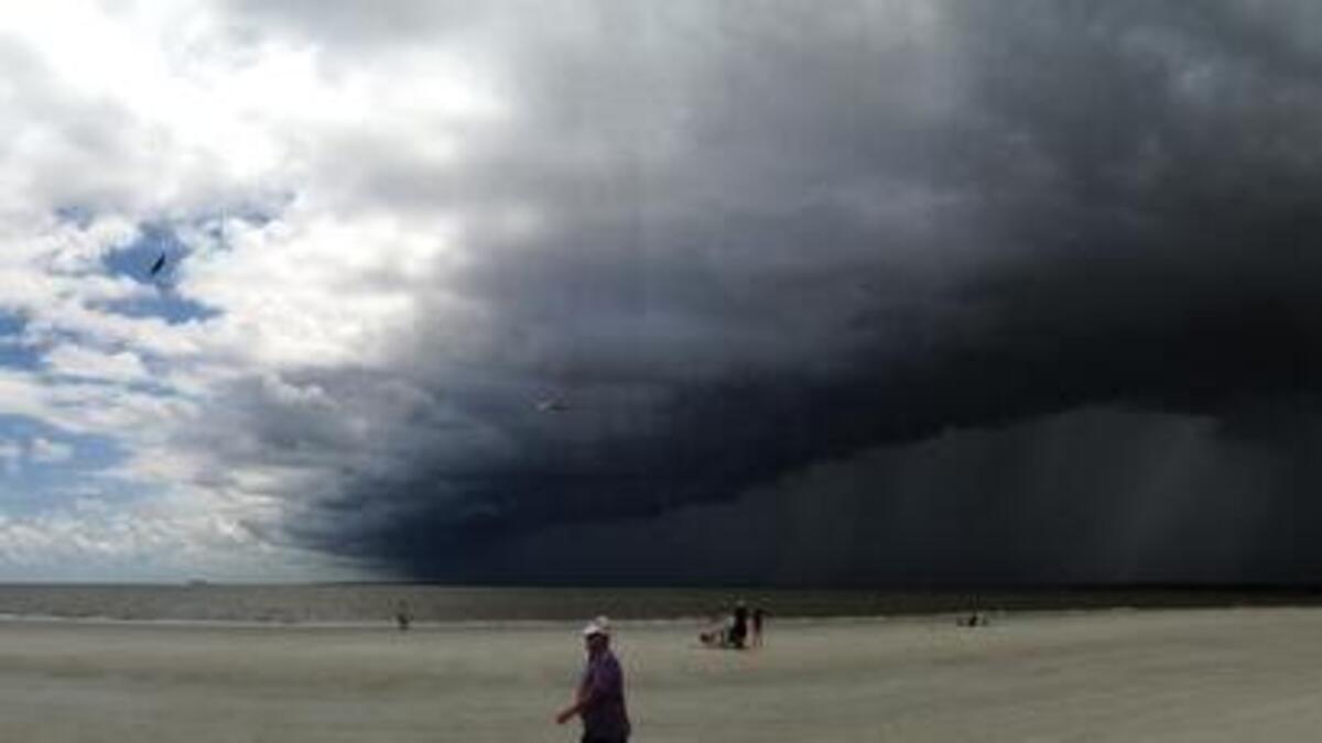 File: Storm front coming across Calibogue Sound from the direction of Savannah, taken at Tower Beach in Sea Pines on July 20, 2013.