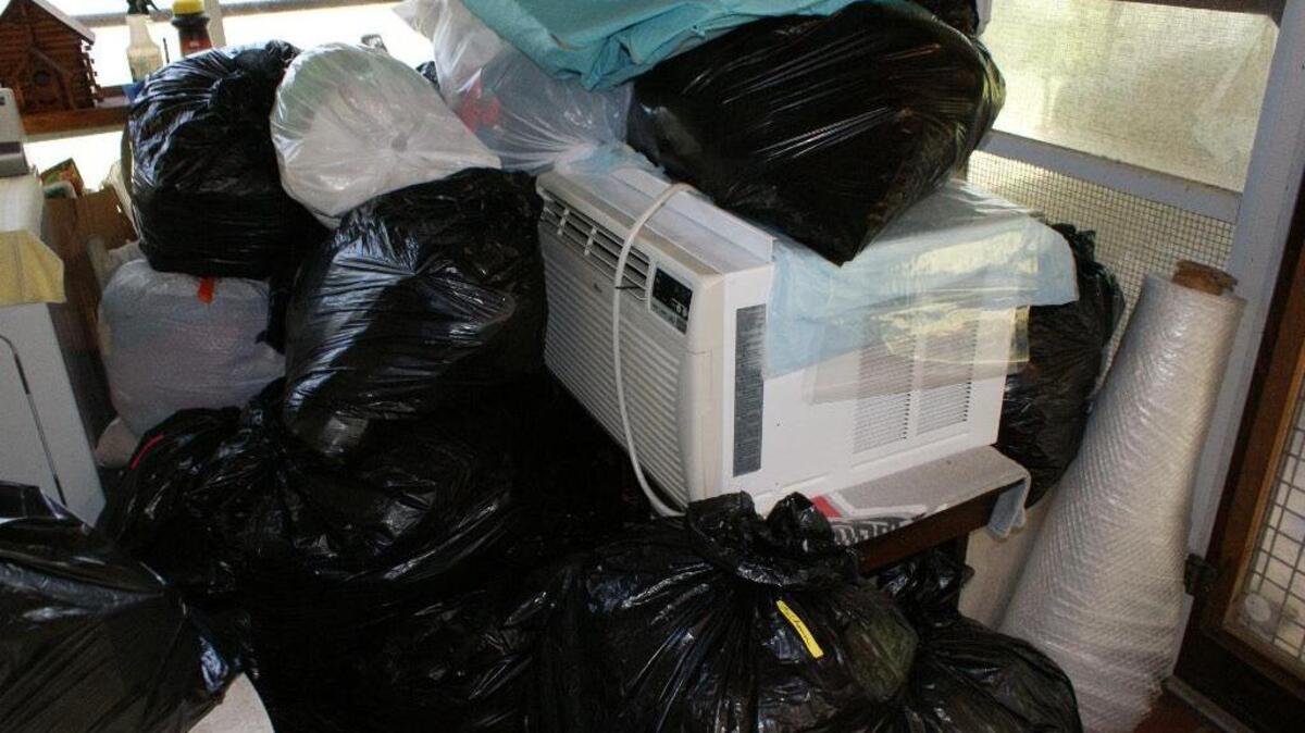 After a good clearing of excess clothes, knick-knacks and other household items, mounds of filled bags await destination to a thrift store.