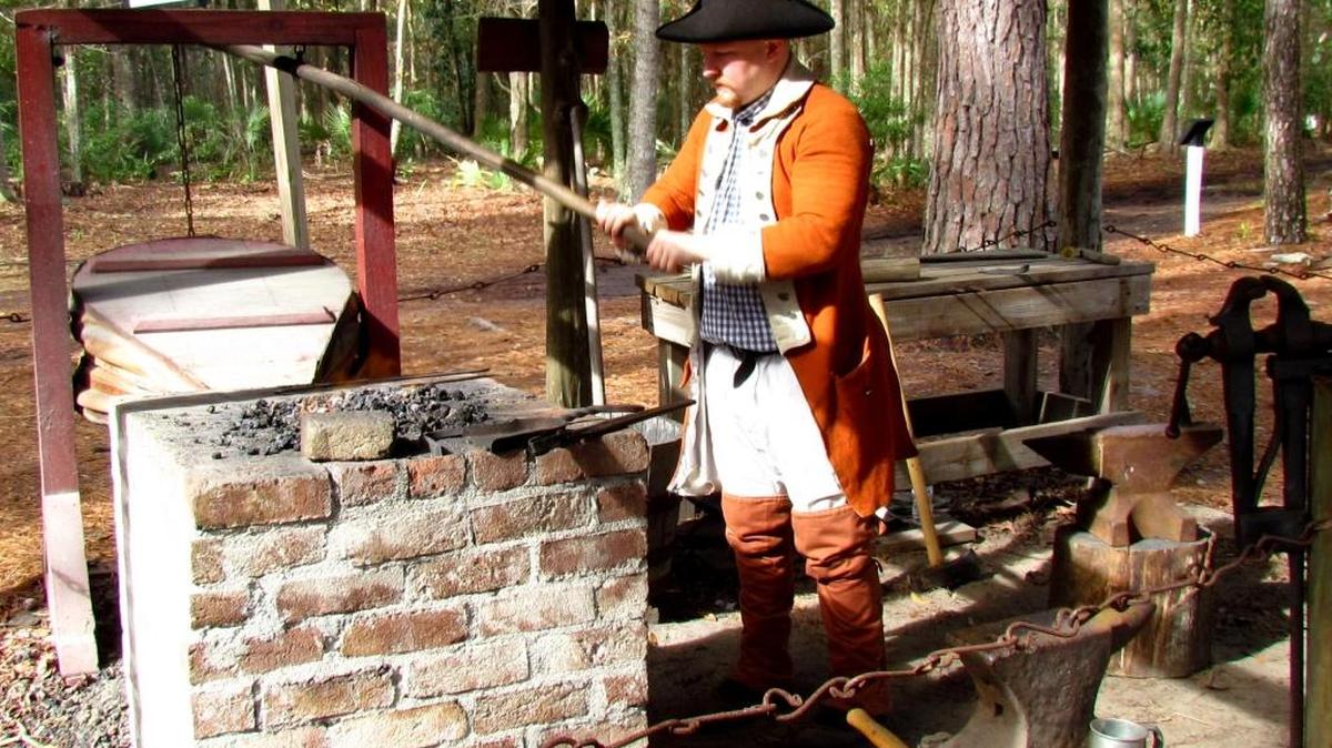 Tools of the trade: a village blacksmith operates his forge at Wormsloe State Historic Site, reenacting one of many handcrafts and skills necessary to make the historic home a successful plantation.