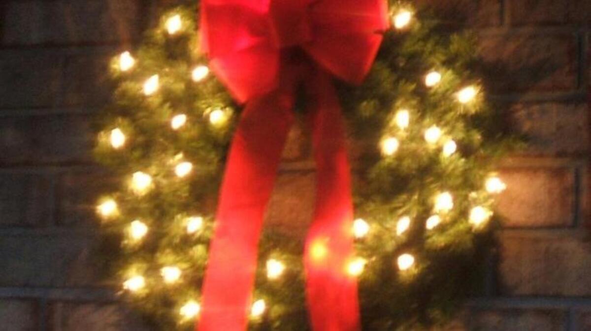 This Christmas wreath adorns a front door at Jean Tanner’s House.