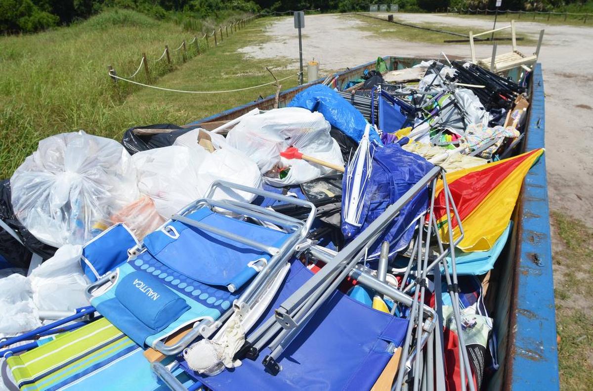 Discarded beach chairs, broken folding canopy tents, crumpled umbrellas and other items fill a 40-yard dumpster at Area 5, the Shore Beach Service trash dump behind the Town of Hilton Head’s Coligny Beach parking lot.